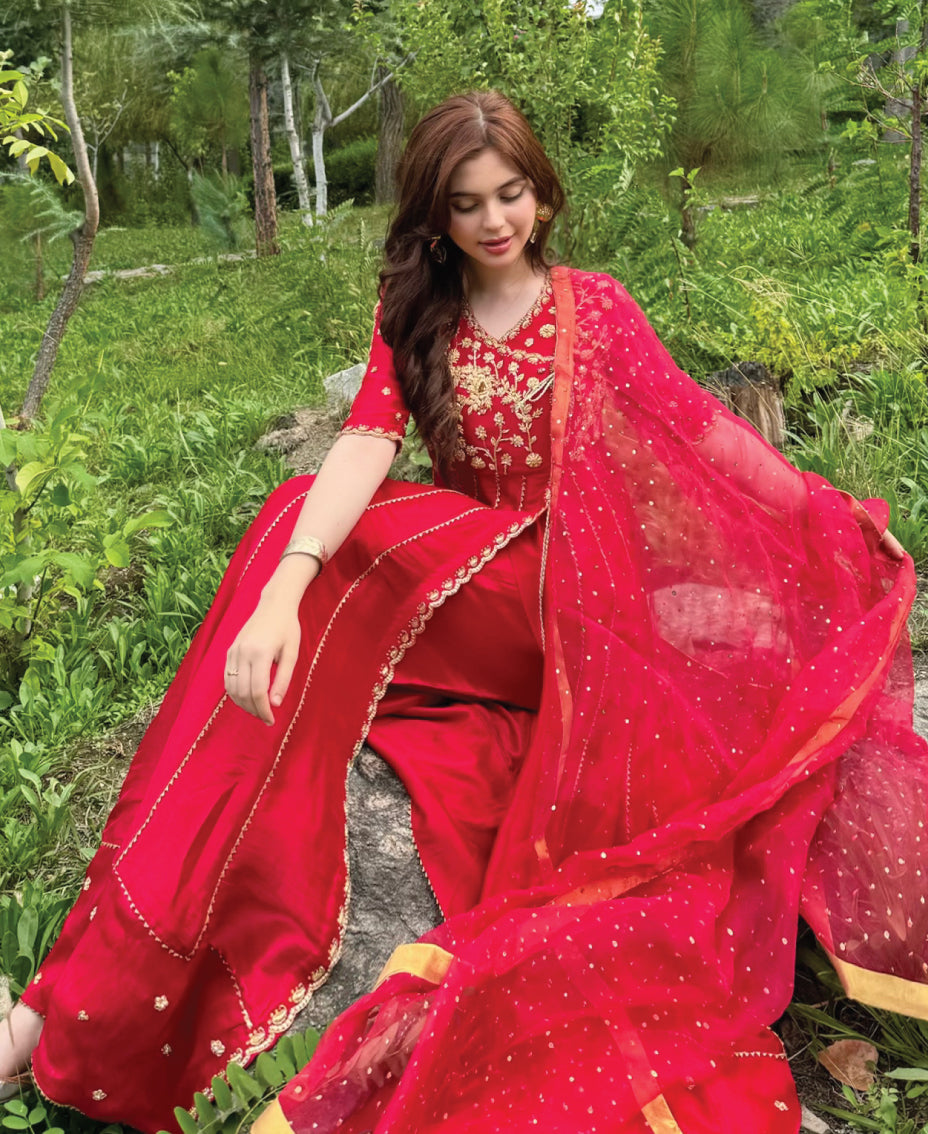 Crimson red women’s formal anghra anarkali frock crafted in sheesha silk with intricate kora and dabka embroidery with paired dupaata and trouser.

