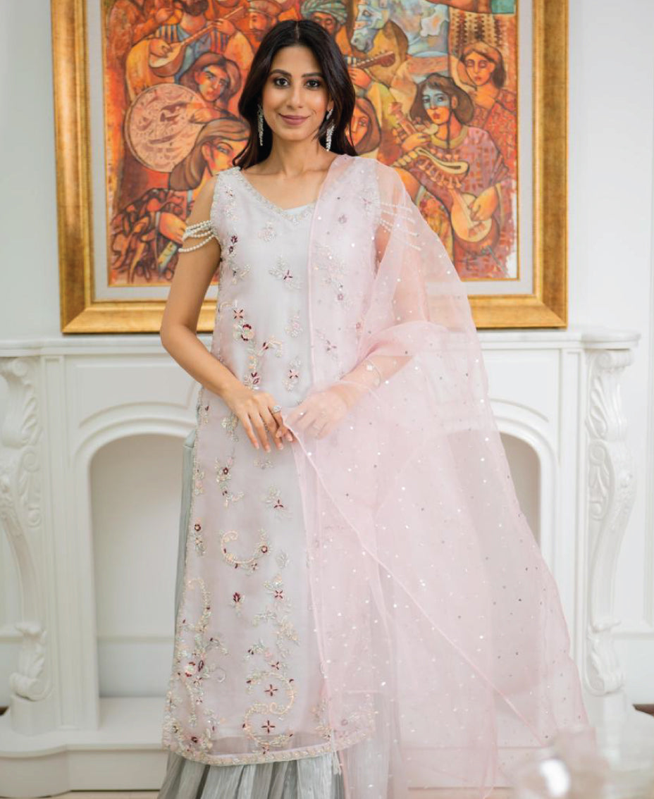 A light PINK embroidered stylish pearl-detail sleeveless outfit with a pink dupatta .