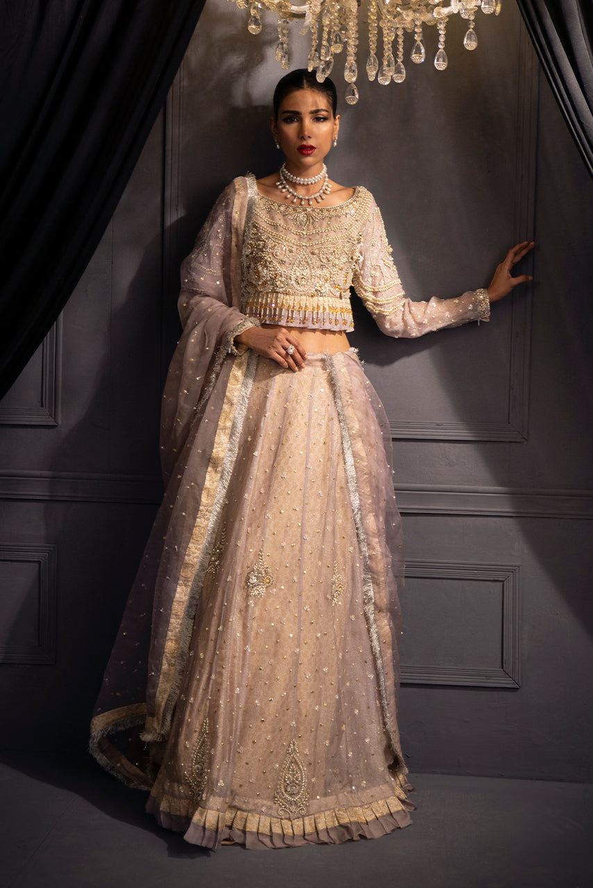 Lilac Lumière designer bridal soft pastel lilac lehenga with pearl, crystal and sequin hand embellishments on shimmer organza, paired with a front and back embroidered choli and framed with a luminous kiran trim dupatta.