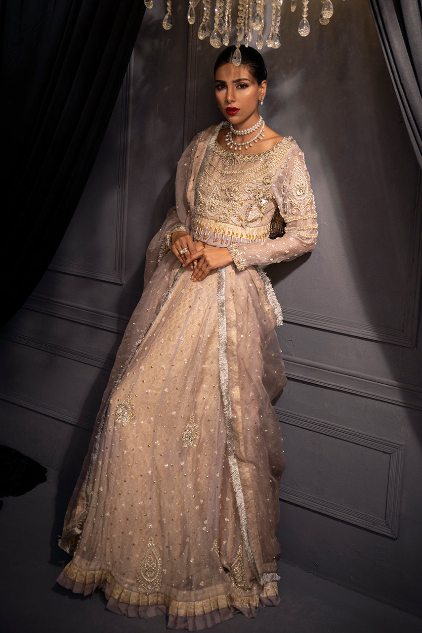 Lilac Lumière artisanal designer lehenga is crafted with exquisite pearl and crystal detailing for the modern luxury bride.
