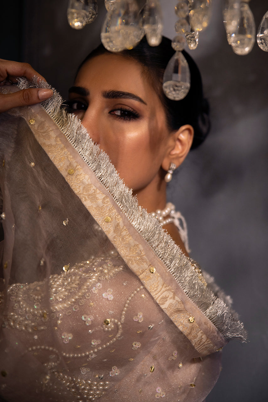The Luxury Lilac Lumière ethereal lilac organza dupatta is adorned with delicate sequin embellishments and shimmering kiran detailing, reflecting timeless designer elegance.