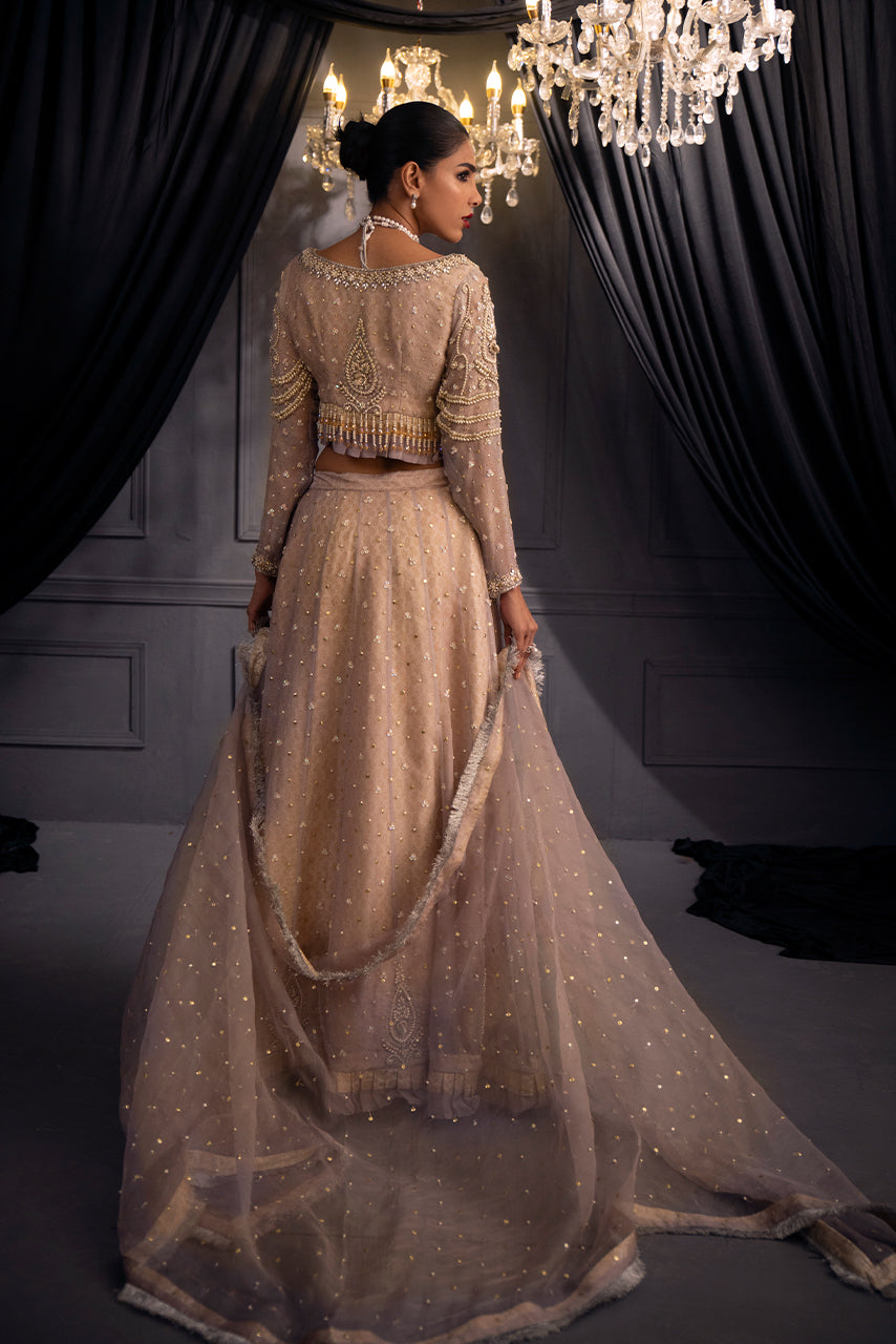 Lilac Lumière pastel lilac designer bridal lehenga has a beautifully embroidered back, flowing organza dupatta and elegant wedding couture craftsmanship.