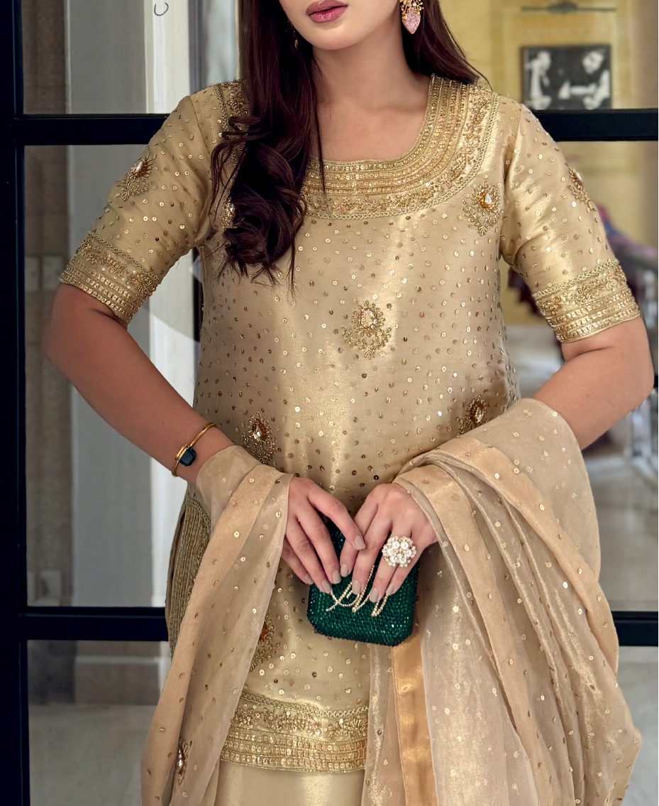 Intricate embroidery detail on lama tissue formal gharara ensemble

