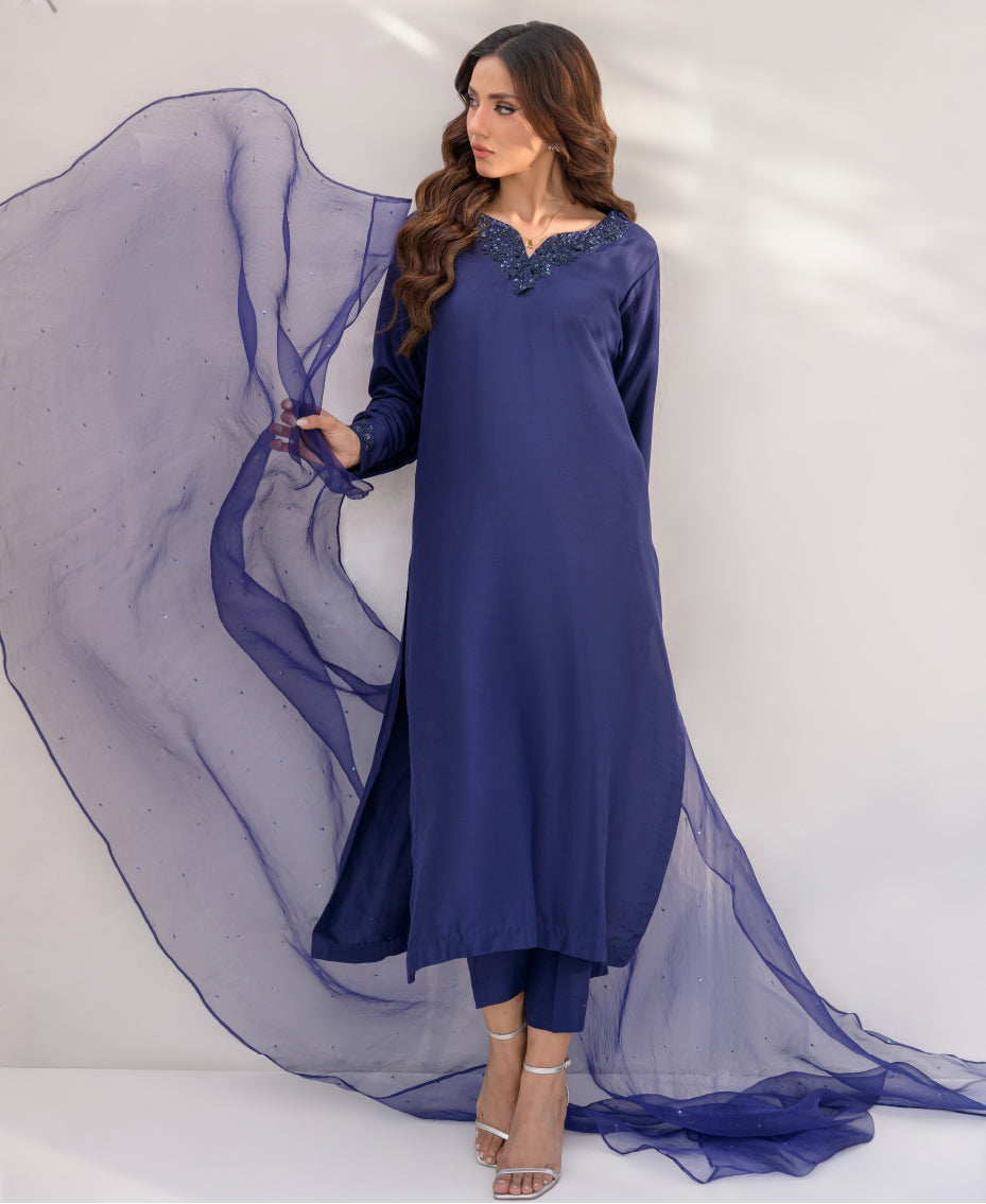 Woman midnight blue raw silk ensemble with flowing organza eid look with dupatta